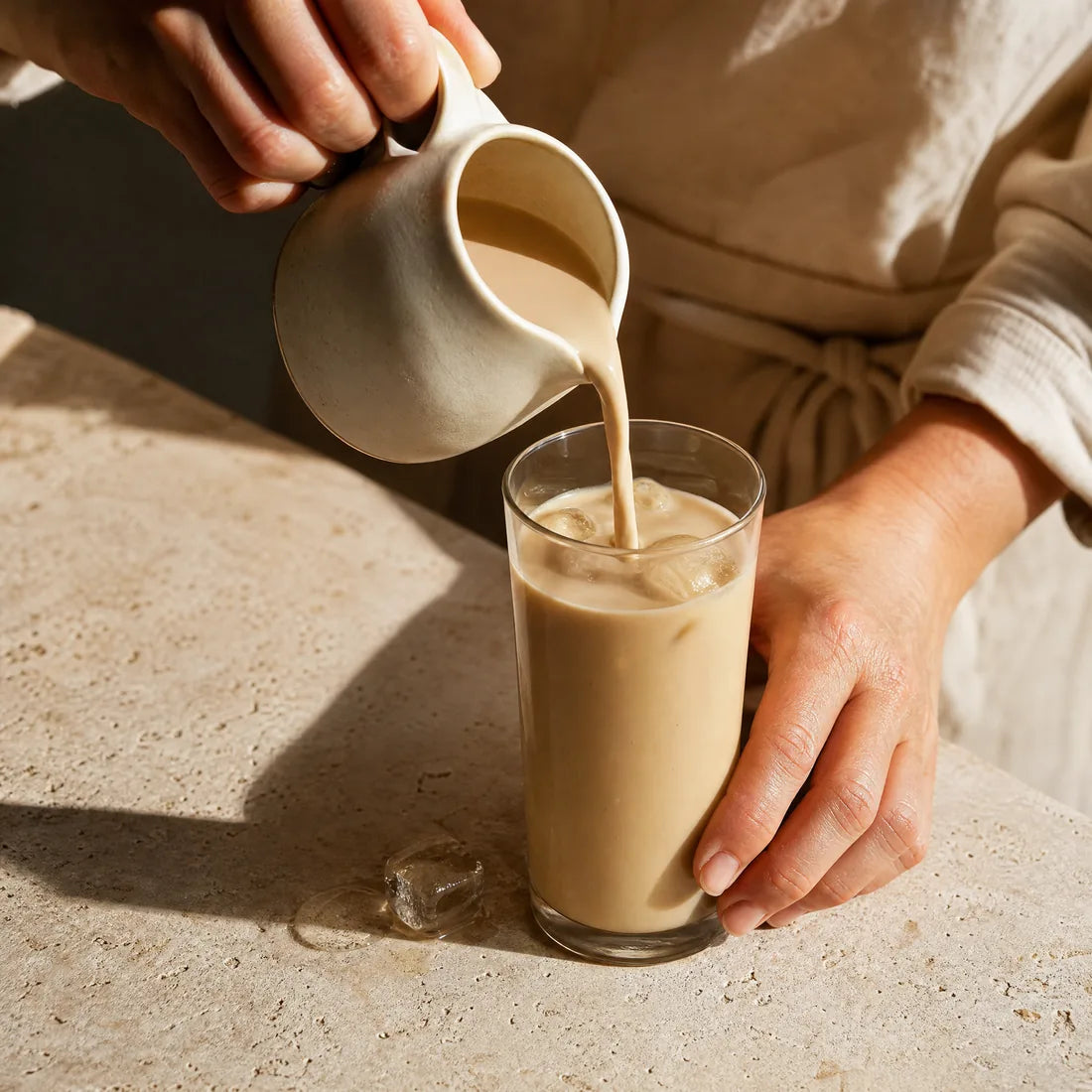 Milk being poured into a glass of Misu concentrate